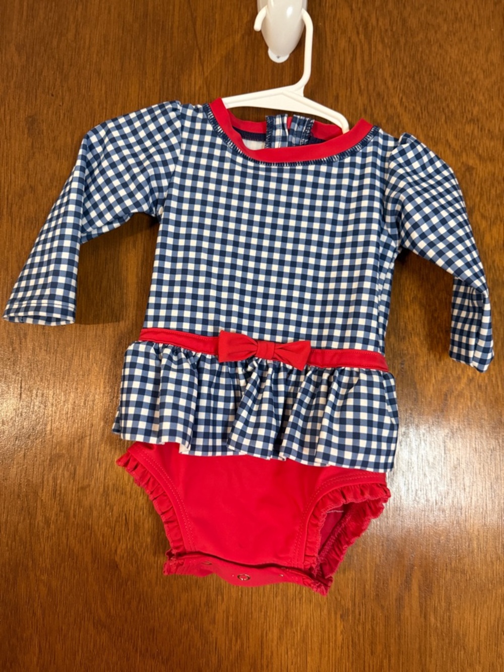 Ruffle Butts Navy Gingham One-Piece with Red Trim and Bow